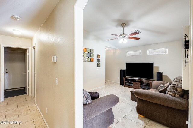 12318 W Bloomfield Rd, El Mirage, AZ 85335 - living room with a ceiling fan, baseboards, and arched walkways
