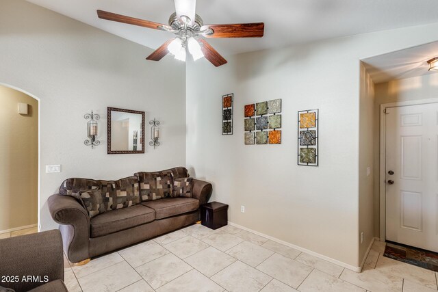 12318 W Bloomfield Rd, El Mirage, AZ 85335 - living room with arched walkways, a ceiling fan, and baseboards