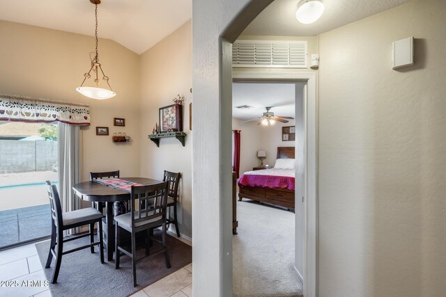 12318 W Bloomfield Rd, El Mirage, AZ 85335 - dining space with lofted ceiling, light tile patterned floors, arched walkways, and ceiling fan