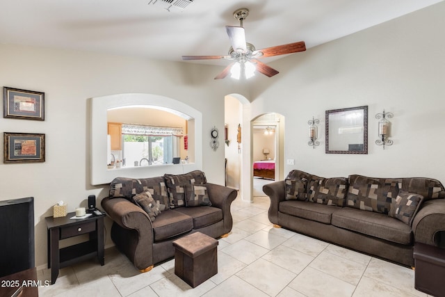 12318 W Bloomfield Rd, El Mirage, AZ 85335 - living area featuring a ceiling fan and arched walkways