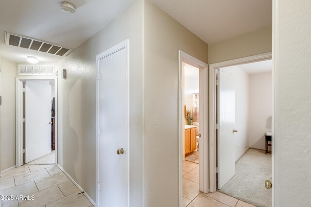 12318 W Bloomfield Rd, El Mirage, AZ 85335 - hallway with light tile patterned floors