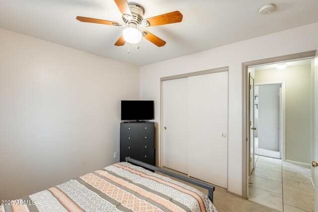 12318 W Bloomfield Rd, El Mirage, AZ 85335 - bedroom with a closet, a ceiling fan, and light colored carpet