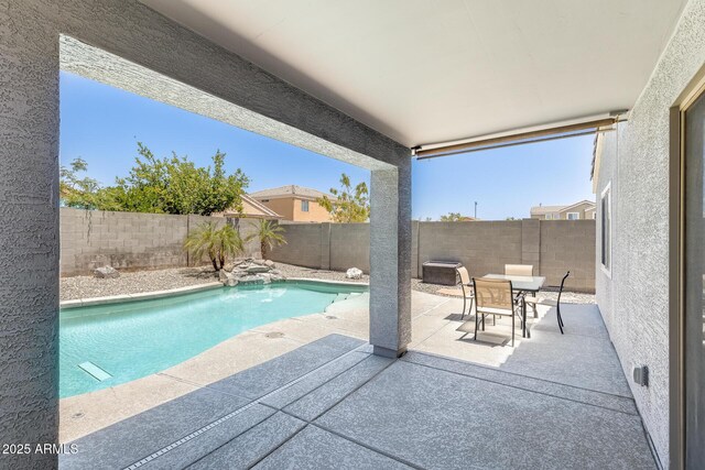 12318 W Bloomfield Rd, El Mirage, AZ 85335 - view of swimming pool with a patio, a fenced backyard, and outdoor dining area