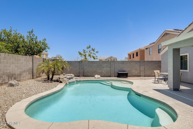 12318 W Bloomfield Rd, El Mirage, AZ 85335 - view of pool with a patio area and a fenced backyard