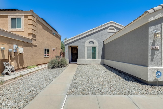 12318 W Bloomfield Rd, El Mirage, AZ 85335 - entrance to property featuring stucco siding and a tiled roof
