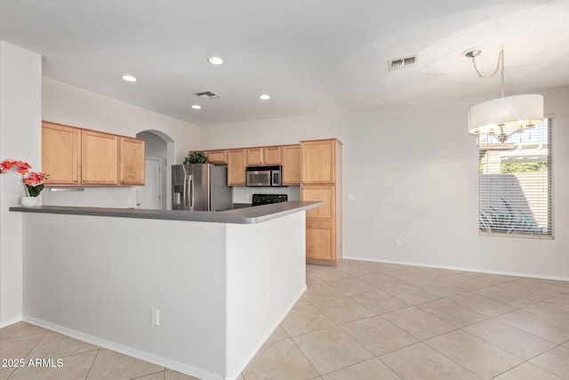 kitchen with pendant lighting, stainless steel appliances, kitchen peninsula, and light tile patterned floors