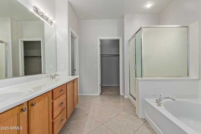 bathroom featuring vanity, tile patterned floors, and plus walk in shower