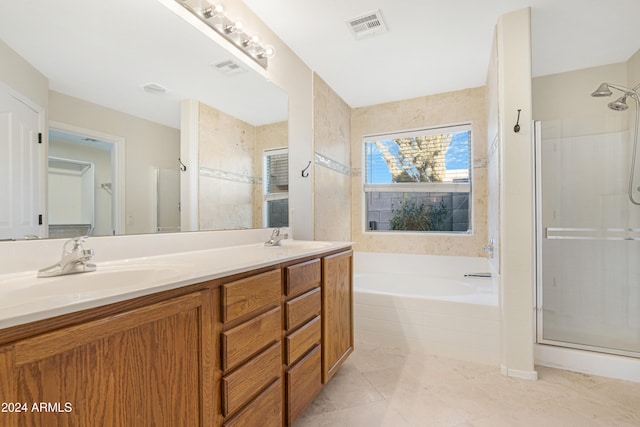 bathroom with independent shower and bath, tile patterned floors, and vanity