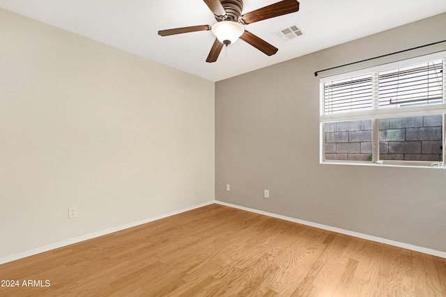 unfurnished room featuring light hardwood / wood-style floors and ceiling fan