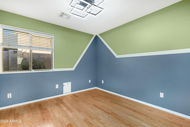 unfurnished room featuring hardwood / wood-style floors