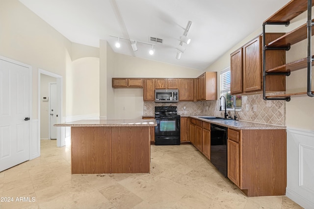 kitchen featuring black appliances, lofted ceiling, a center island, tasteful backsplash, and sink