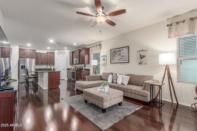 living room with recessed lighting, ceiling fan, baseboards, visible vents, and dark wood-type flooring
