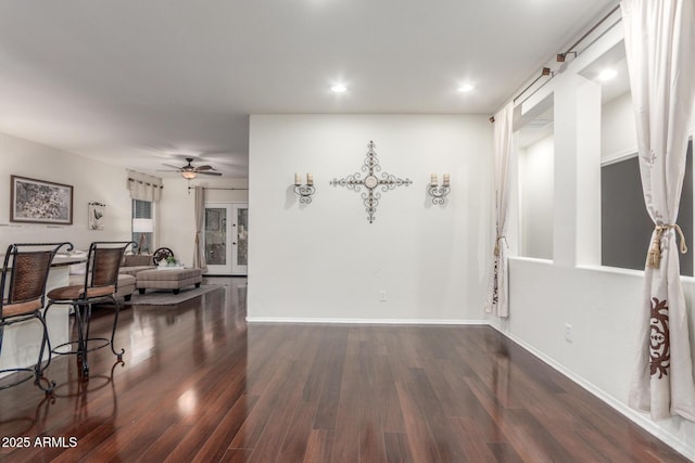 dining room with wood finished floors, ceiling fan, recessed lighting, and baseboards