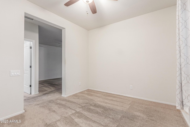unfurnished room with ceiling fan, carpet, and baseboards