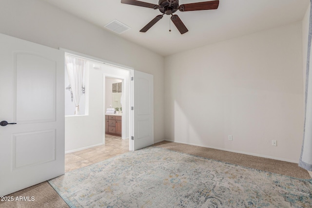 unfurnished bedroom featuring baseboards, visible vents, a ceiling fan, and connected bathroom