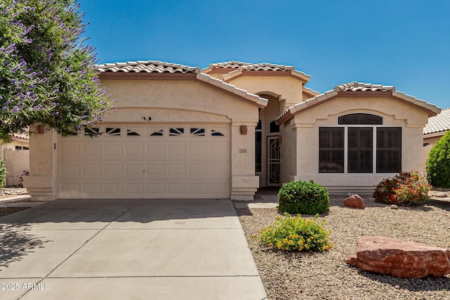 20424 N 96th Ln, Peoria, AZ 85382 - mediterranean / spanish-style house with stucco siding, driveway, a garage, and a tiled roof