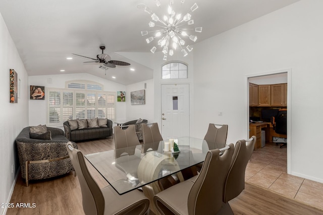 20424 N 96th Ln, Peoria, AZ 85382 - dining area with lofted ceiling, a chandelier, light wood-style floors, baseboards, and ceiling fan