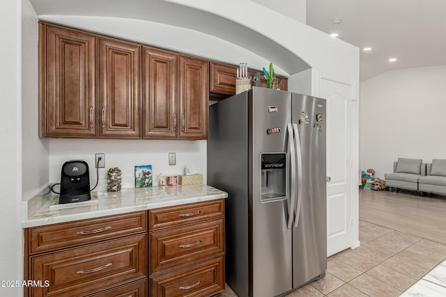 20424 N 96th Ln, Peoria, AZ 85382 - kitchen with stainless steel refrigerator with ice dispenser, light countertops, light tile patterned flooring, recessed lighting, and brown cabinets