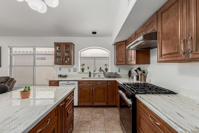 20424 N 96th Ln, Peoria, AZ 85382 - kitchen featuring black gas stove, under cabinet range hood, white dishwasher, a sink, and glass insert cabinets