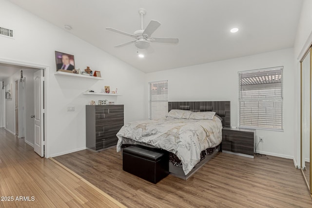 20424 N 96th Ln, Peoria, AZ 85382 - bedroom featuring lofted ceiling, wood finished floors, baseboards, ceiling fan, and recessed lighting