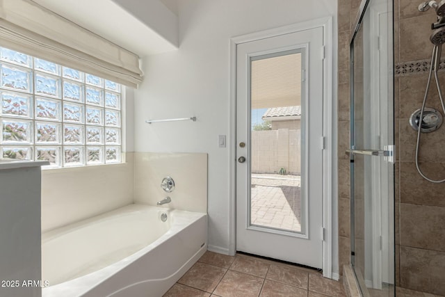 20424 N 96th Ln, Peoria, AZ 85382 - full bathroom featuring a shower stall, a bath, and tile patterned flooring