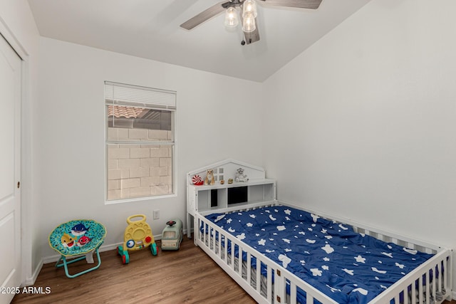20424 N 96th Ln, Peoria, AZ 85382 - bedroom featuring wood finished floors, baseboards, a closet, and ceiling fan