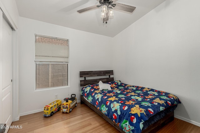 20424 N 96th Ln, Peoria, AZ 85382 - bedroom with wood finished floors, baseboards, a closet, and a ceiling fan