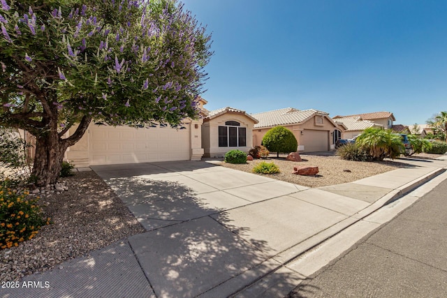 20424 N 96th Ln, Peoria, AZ 85382 - mediterranean / spanish home with driveway, an attached garage, stucco siding, and a tiled roof
