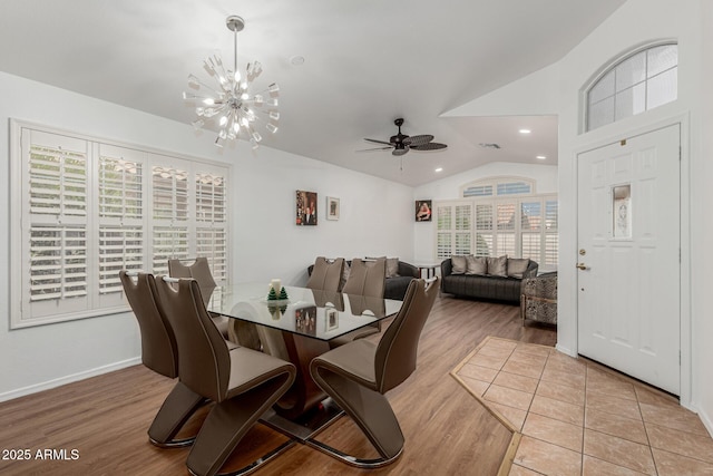 20424 N 96th Ln, Peoria, AZ 85382 - dining area with vaulted ceiling, light wood finished floors, a chandelier, a ceiling fan, and baseboards