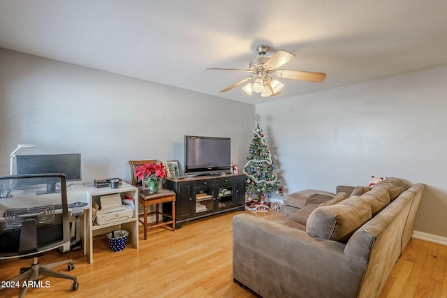 living room with hardwood / wood-style floors and ceiling fan