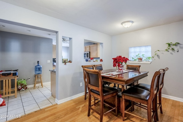 dining space featuring light hardwood / wood-style floors