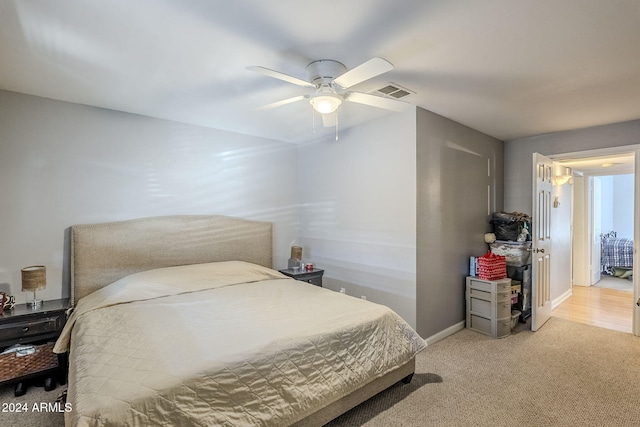 carpeted bedroom with ceiling fan