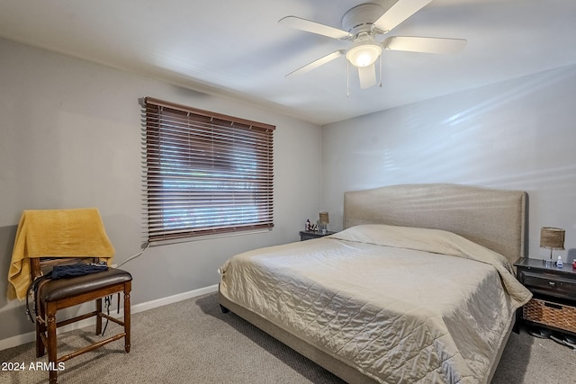 bedroom featuring ceiling fan and carpet