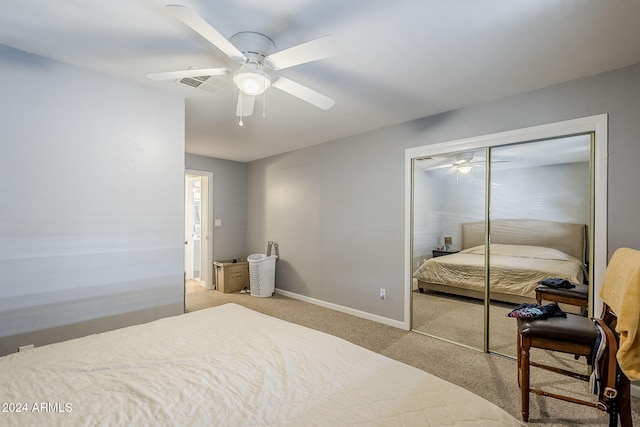 carpeted bedroom with a closet and ceiling fan