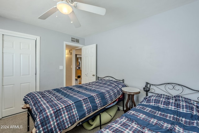 bedroom featuring ceiling fan, carpet floors, and a closet