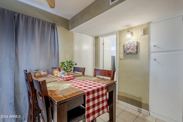 dining space with light tile patterned floors