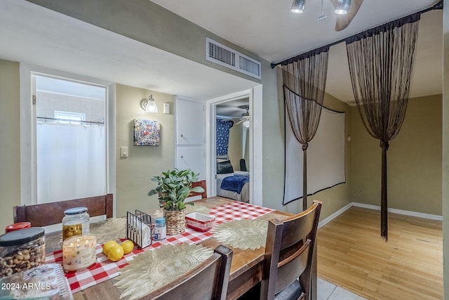 dining space featuring ceiling fan and light hardwood / wood-style floors