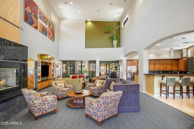 lobby with a towering ceiling and recessed lighting