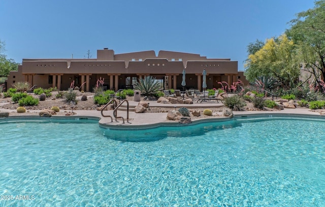 community pool with a patio area