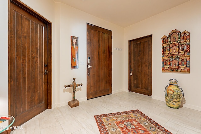 entryway featuring baseboards