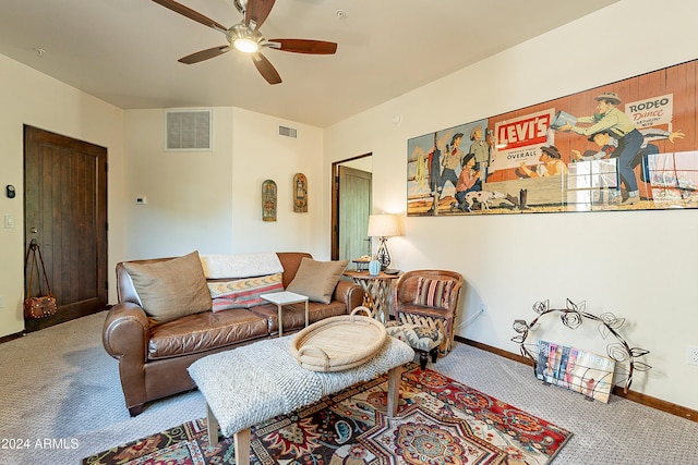 carpeted living room featuring baseboards, visible vents, and ceiling fan