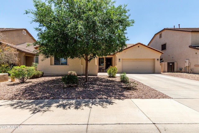 17937 W Westpark Blvd, Surprise, AZ 85388 - view of front of property featuring a garage, driveway, stucco siding, and a tiled roof