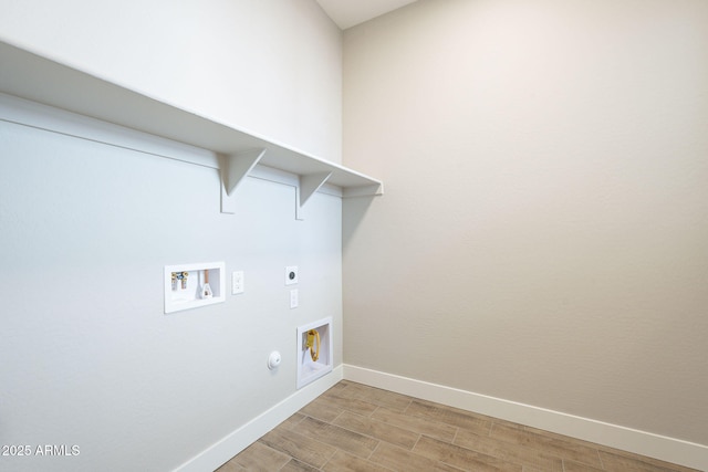 laundry area featuring electric dryer hookup, gas dryer hookup, and washer hookup