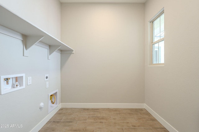 clothes washing area with hookup for a gas dryer, washer hookup, light wood-type flooring, and hookup for an electric dryer