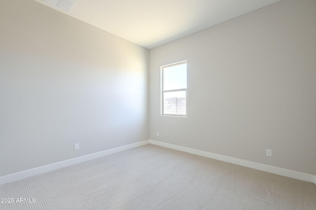 empty room with light colored carpet