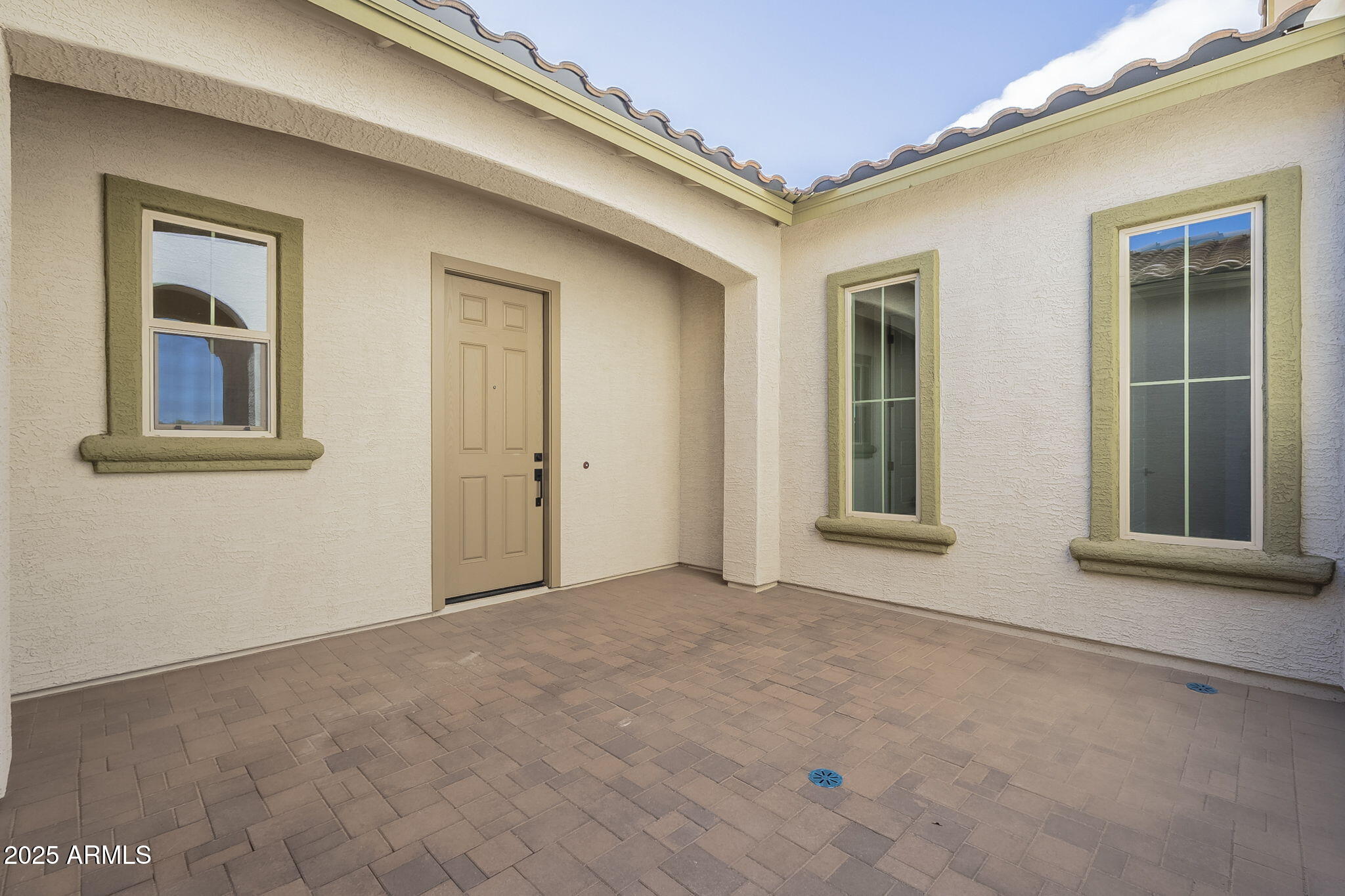 doorway to property featuring a patio