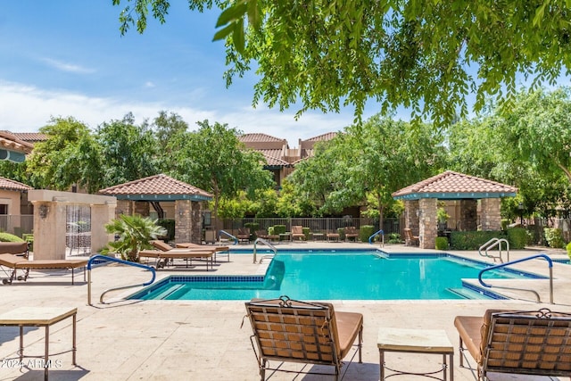 view of swimming pool featuring a patio area