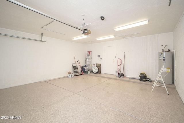 garage with a garage door opener and electric water heater