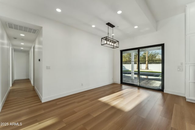 unfurnished dining area featuring hardwood / wood-style flooring