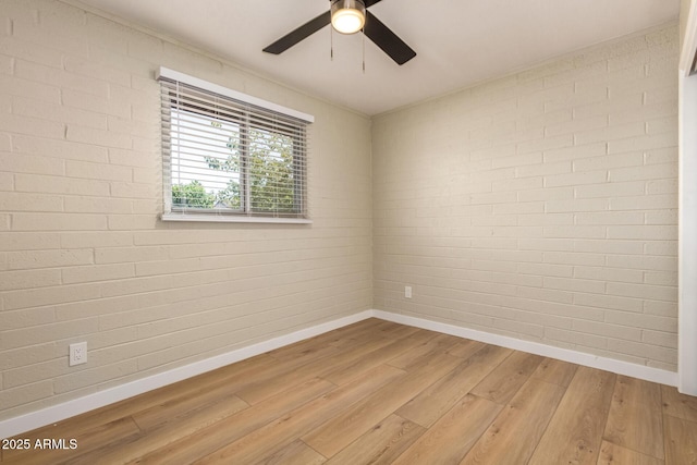 915 E Commonwealth Pl, Chandler, AZ 85225 - empty room featuring light wood-type flooring, a ceiling fan, and brick wall